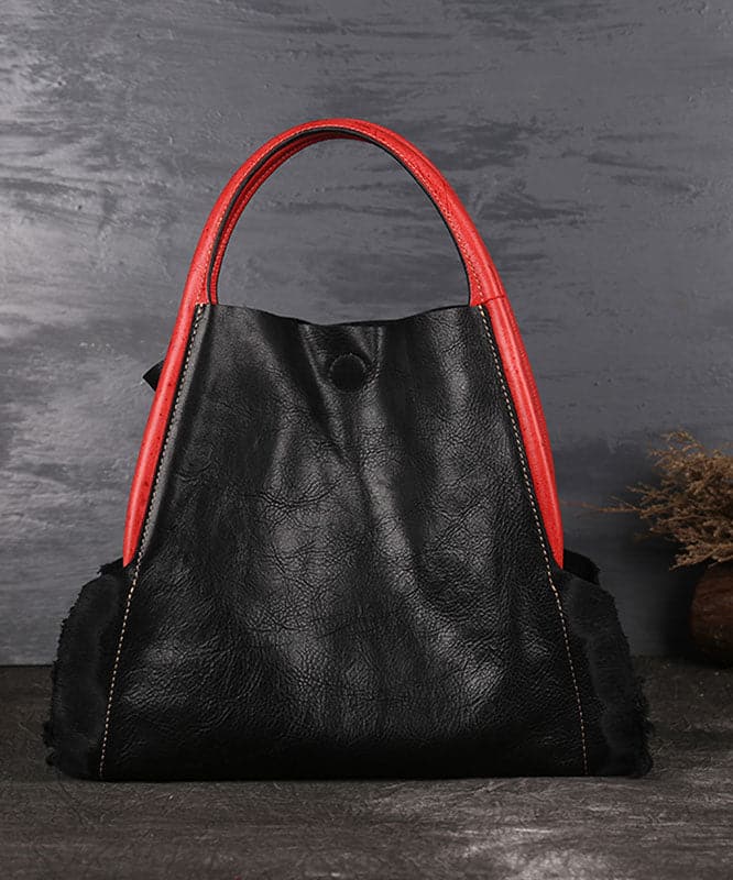 Wunderschöne schwarze Satchel-Handtasche aus Kalbsleder mit asymmetrischem Design