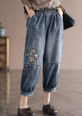 Pantalon court en denim de coton bleu ample avec poches à taille élastique et patchwork appliqué pour l'été