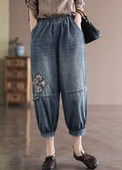 Pantalon court en denim de coton bleu ample avec poches à taille élastique et patchwork appliqué pour l'été